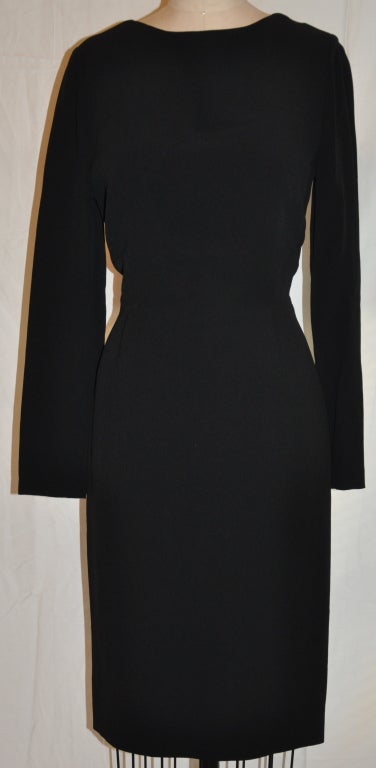 Calvin Klein black cocktail dress has a deep back feature.
   The front length measures 38