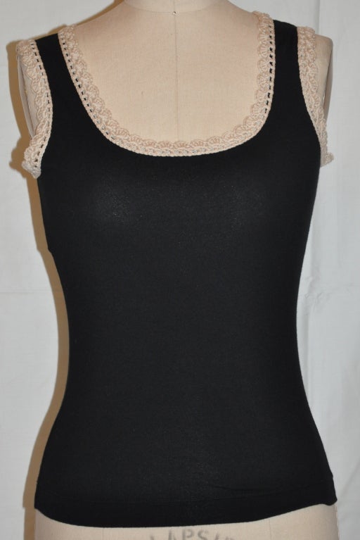 Moschino black tank has hand-chochet accents along the neckline and armholes. Cotton-blend measures 14 3/4