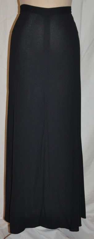 Calvin Klein black maxi skirt is cut slightly flare. The skirt has a center back zipper which measures 7