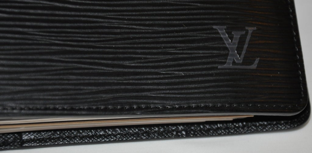 Louis Vuitton black leather stenciled agenda measures 5 1/2
