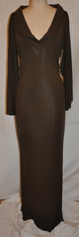 Jean Paul Gaultier dramatic coco-brown maxi body-hugging dress has a deep-V front. The shoulders are wide for a more dramatic appearance as all of Gaultier's outfits are!
   The sleeves are slightly tapered by the underarm and extends to a