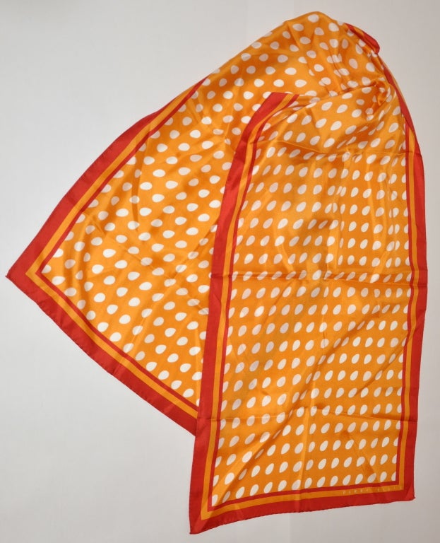 Perry Ellis tangerine, red and white silk scarf measures 17