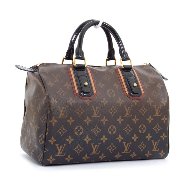 This is an authentic LOUIS VUITTON Monogram Speedy 30 MIRAGE Bag. It is done in beige and brown monogram canvas with black fade down exterior. This bag features gold tones hardware, coordinating black alcantara interior, double rolled black leather