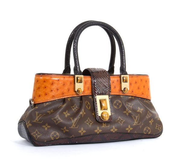 This is an authentic LOUIS VUITTON Waltz MACHA Exotic Ostrich Bag. This Louis Vuitton combines expert craftsmanship and fine materials in a bag that is truly beautiful and will be the highlight of your collection. It is constructed of a body of
