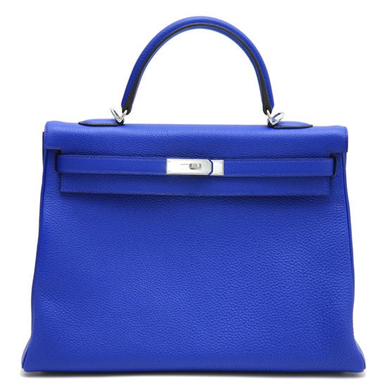 This is an authentic HERMES Blue Electric Togo Leather 35cm Kelly Bag. Bleu Electrique is one of Hermes' most fantastic colors and newest Blue's, paired here with Palladium hardware for an absolutely divine color combo. This bag comes with all