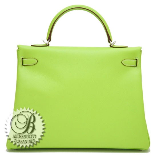 HERMES Kiwi Lichen Interior Epsom Leather PHW 35cm Kelly Bag. This is a sought after limited edition candy color..perfectly vibrant for the woman in love with Hermes rare pieces. The exterior is gorgeous Kiwi, bright a light, and the interior is a