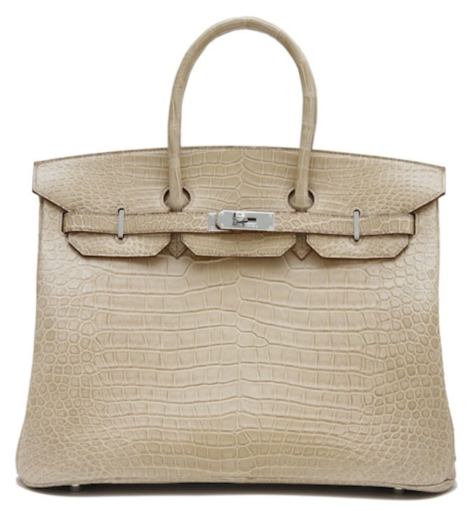 This is an authentic HERMES 35cm Poussiere Matt Crocodile Birkin Bag. This is a stunning color and rare to find. It is a gorgeous beige/ light brown. It has shiny Palladium hardware and a perfect wide interior compartment with dual rolled handles.