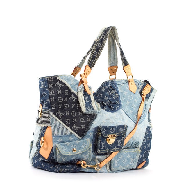 This is an authentic LOUIS VUITTON Denim Patchwork CABBY Tribute Style Large Bag. This rare bag is done in patchworked denim pieces in different shades of blue jean with vachetta leather trim and gold tone hardware. This bag features two denim