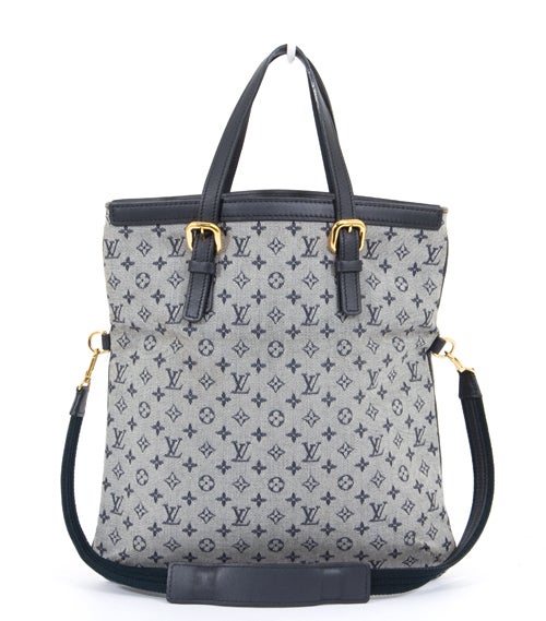 This is an authentic Louis Vuitton Francoise Mini Monogram Bag. It is done in signature Louis Vuitton Mini Lin monogram canvas with navy blue smooth leather trim and golden hardware. The bag is a unique style, as you can carry it like a tote by the