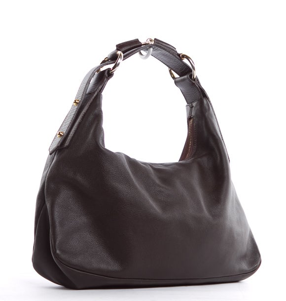 This is an authentic GUCCI Brown Leather Horsebit Hobo Bag. Done in supple brown leather with signature gold-tone on the Gucci horsebit detailed hardware of the strap, this bag is a perfect style for everyday wear, adding an elegant touch to any
