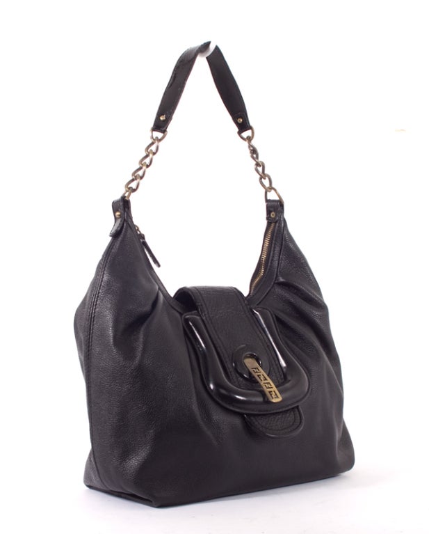 This is an authentic FENDI Black Nappa B Bis Baby Single Hobo Bag. Done in lovely black leather, this bag features black leather trim, pleating on the front of the bag, bronze hardware, a flat patent leather and bronze chain handle, single zip