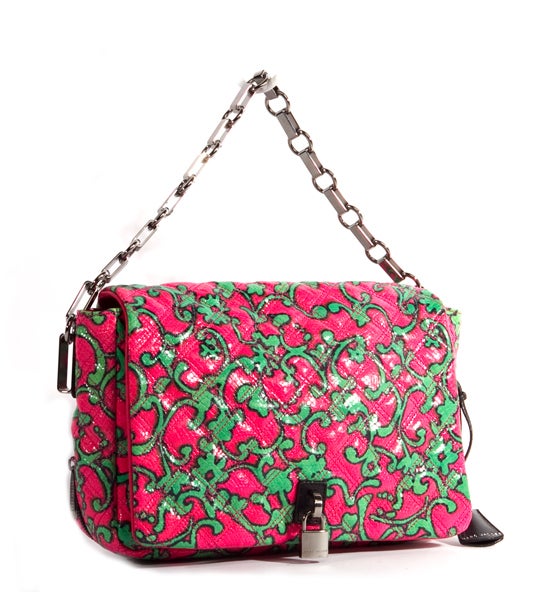 This is an authentic Marc Jacobs Pink Green Quilted Misfit Tote Bag. It is done in signature quilted Marc Jacobs leather in a neon pink and bright green paisley pattern with gorgeous brushed silver hardware and black leather trim. The strap is a