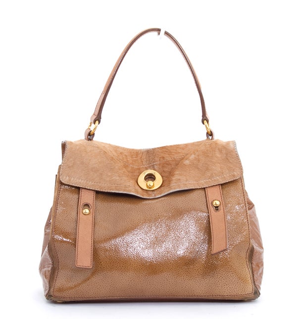 This is an authentic YSL YVES SAINT LAURENT Pony Hair Patent Embossed Muse II Two Bag. It is done in soft pony hair and coordinating tan patent leather. This bag features a single flat leather strap, a pony hair flap over, dual front straps, and a