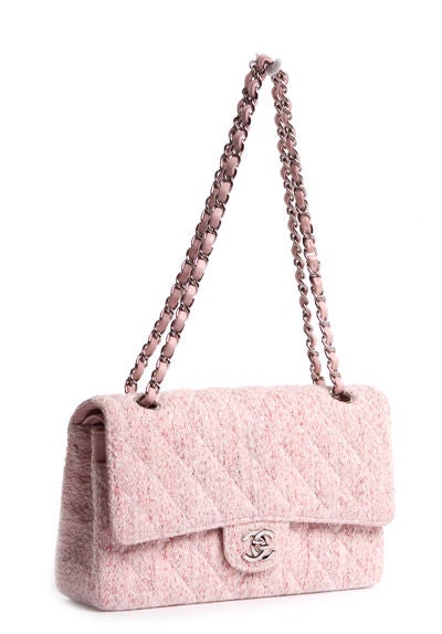 This is an authentic CHANEL Light Tweed Classic Double Flap Bag. Done in soft tweed with the softest, most supple Chanel signature leather interior, this bag features a front classic CC turn lock closure and a signature Chanel chain linking shoulder