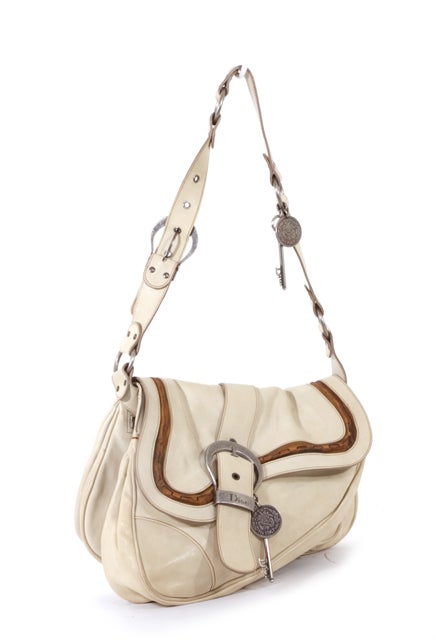 This is an authentic DIOR Ivory Beige GAUCHO Shoulder Bag. Done in ivory distressed leather with light brown leather details and silver hardware, this bag is highly sought after by Dior lovers everywhere. This bag features a flat leather adjustable