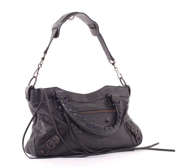 This is an authentic BALENCIAGA Anthracite First Arena Motorcycle Bag. It is done in fabulous supple coal/grey leather. This bag features silver tone hardware, dual leather handles, a front exterior zip pocket, and classic Balenciaga detail. This