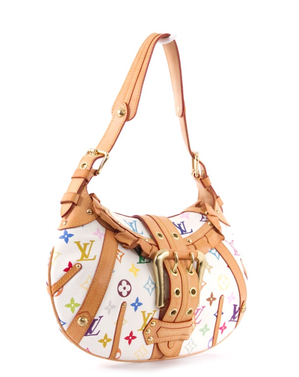This is an authentic LOUIS VUITTON White Multicolor Leonor Bag Purse. It is done in signature Louis Vuitton white monogram multicolor canvas with vachetta leather trim and golden tone hardware. The bag features a single flat leather handle, and a