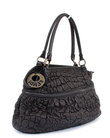 This is an authentic FENDI black Waffled Bubble Chef Bag. It is done in soft supple black nappa leather with subtle charcoal undertones. This bag features two rolled handles and brass hardware. This is a great every day bag that can easily