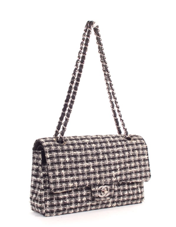 This is an authentic CHANEL Black White Tweed Chain Shoulder Bag Flap Purse. Done in soft tweed with the most supple Chanel signature leather interior, this bag features a front classic CC turn lock closure and a signature Chanel chain linking
