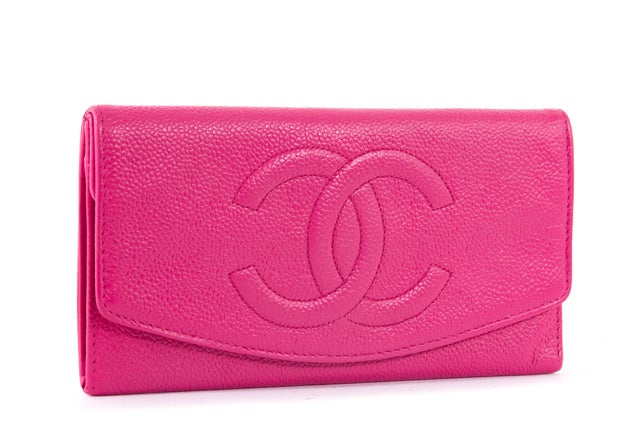 This is an authentic CHANEL Pink Caviar Leather Wallet Clutch. Done in lovely hot pink caviar leather, this wallet features a double flap and an exterior back side coin pouch. Inside, you will find a gusseted compartment as well as the second flap