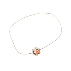 HERMES Orange CUBED H Hermes Pendant Necklace