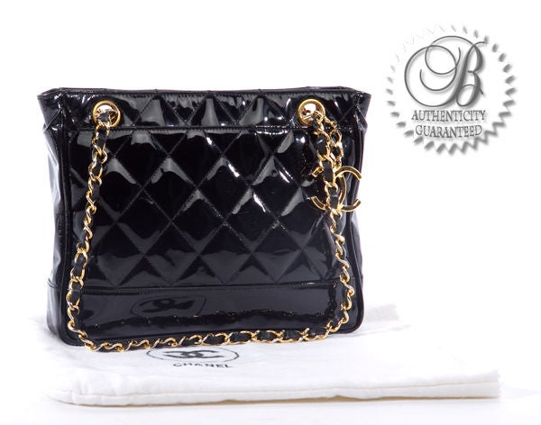 This is an authentic Chanel Black Patent Leather Petite Shopping Bag Vintage. It is done in gorgeous black patent quilted leather with elegant golden toned hardware. The bag features two chain and leather entwined straps with a Chanel interlocking C