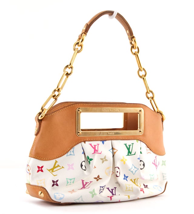 This is an authentic Louis Vuitton Monogram Multicolor Judy PM Bag. It is done in white multicolor LV monogram canvas and features vachetta leather trim, gold toned hardware, a chain link shoulder strap, and hardware stud accents. This versatile bag