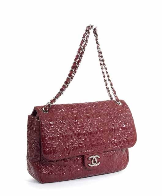 This is an authentic CHANEL Bordeaux Patent Embossed Moscow Moscou Flap Bag. This gorgeous bag is done in Bordeaux patent embossed leather. This bag features brassy silver hardware, a front signature Chanel 