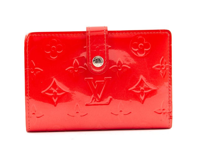 This is an authentic Louis Vuitton Orange Sunset Vernis French Purse Wallet. The wallet is done in stunning orange coral vernis exterior, coordinating leather interior, and gold toned hardware. This wallet is where style meets function, featuring an