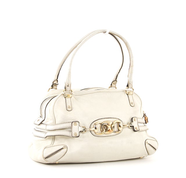 This is an authentic GUCCI White Leather Horsebit Large Satchel Bag. This beauty is done in supple white leather with gold-toned hardware accents. It features two comfortable rolled handles, dual bamboo zipper pulls, and leather trim. The interior