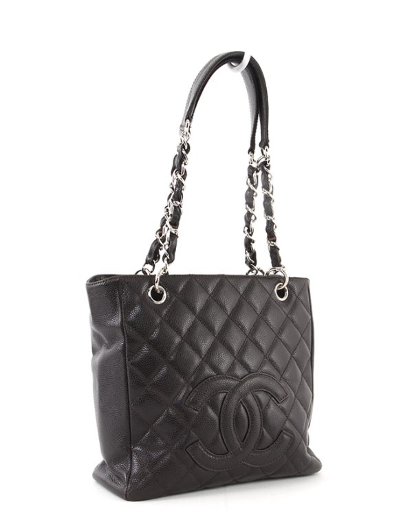 This is an authentic Chanel bag. Done in signature brown quilted caviar leather with silver-toned hardware, this beauty features a large CC logo on the front exterior, dual leather-chain link handles, an exterior back flat pocket, and a partial snap