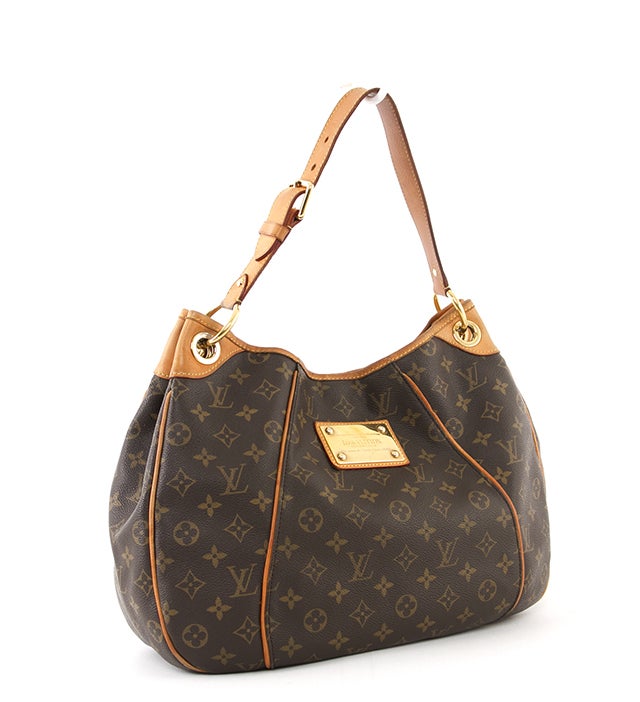 This is an authentic Louis Vuitton Gallleria PM bag. Done in the signiture monogram canvas, this bag is a great carry-all. This bag is trimmed in natural leather and features the 