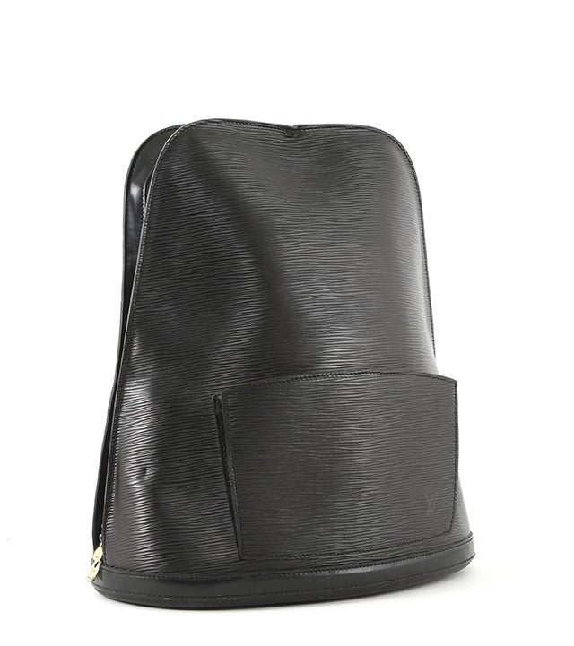 This is an authentic Louis Vuitton Epi Leather backpack. The Louis Vuitton Epi Leather collection was first introduced in 1985 and was created to respond to the demand for more durable leather necessary in modern travel conditions. Epi leather is