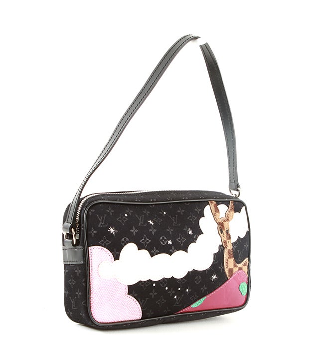 This is an authentic Louis Vuitton bag. This youthful bag is made from satiny black monogramed textile. Over this textile is a playful scene made from various materials featuring a deer and some clouds. With a smooth leather strap and silver