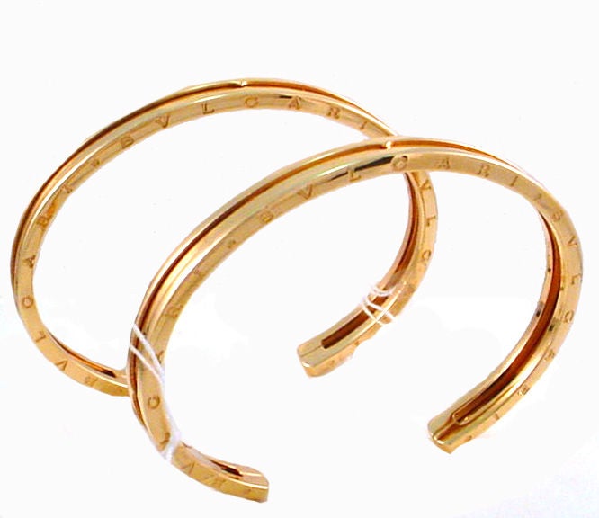 Signed Bvlgari, these 18kt rose gold B. Zero 1 cuffs are very stylish! They can be worn as a pair but great as a single. They are 5.5mm wide, each weighs 13.5 DWT/ 21 Grams, and will fit a size 7 wrist. Both have an original box and appear as new.