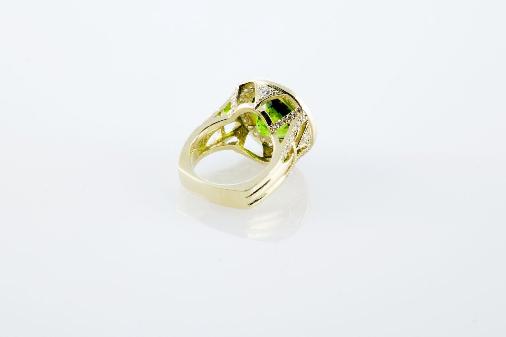 10.5 carat Pakistani Peridot set with 1.10 carats of F/G VS Diamonds and 20.0 grams of 18K Yellow Gold.