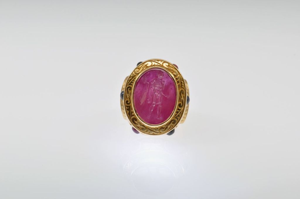Ruby Intaglio (modern) set with 3.10 carats of multi-colored Sapphire cabochons and 32.86 grams of 18K Yellow Gold.