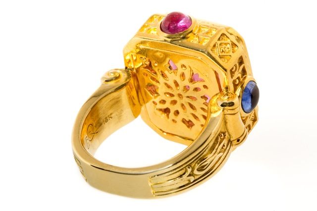 This exquisite Tourmaline intaglio dating from the early 19th Century is set with 2 carats of multi-colored Sapphire cabochons and 18K Yellow Gold, flash finished with 24K for a luxurious saturation of color.  The intricate hand carved detail makes
