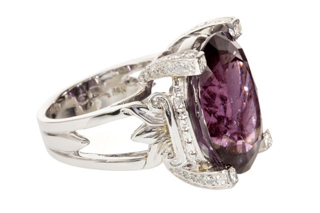 20.19 carat natural purple Tourmaline set with 18K White Gold and 0.52 carats of F/G VS Diamonds.