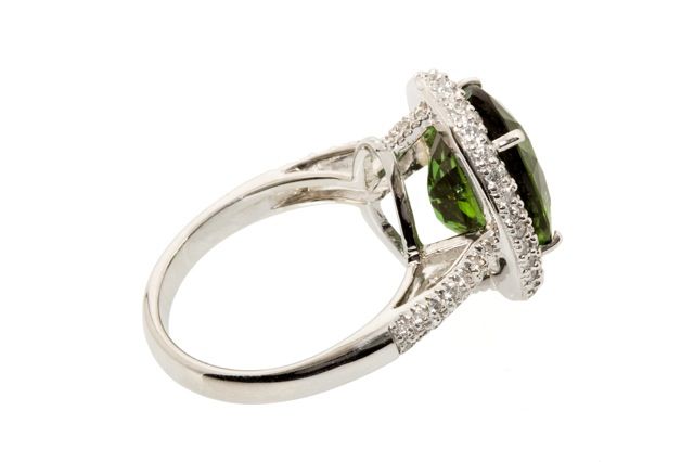 6.08 carat green Tourmaline set with 18K White Gold and 1.20 carats of F/G VS Diamonds.