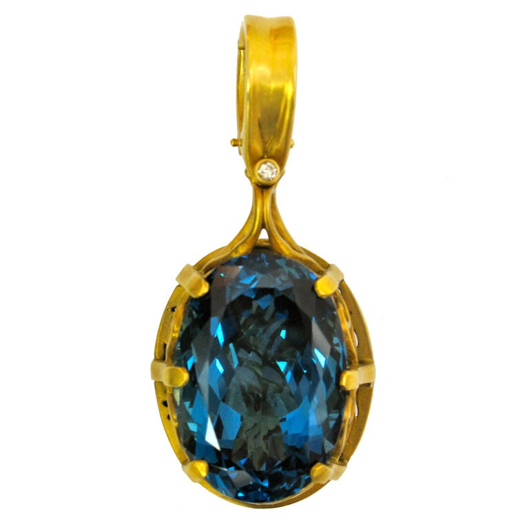 Stunning 40 Carat London Blue Topaz Gold Hand-Carved Pendant For Sale