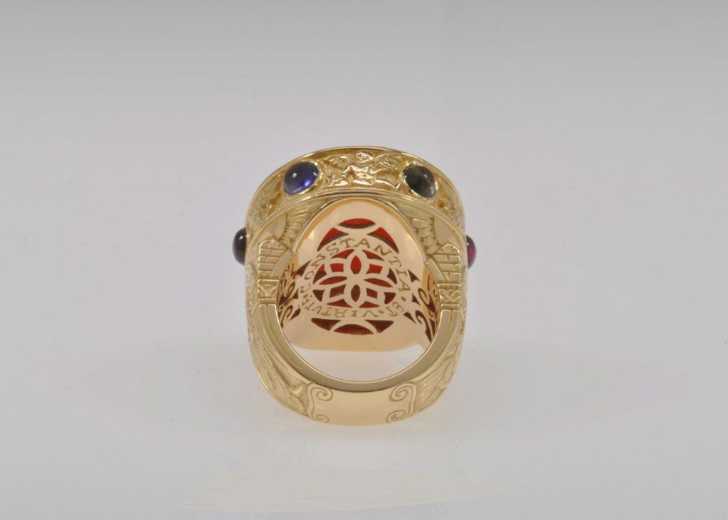 The Carnelian intaglio, itself, dates from the early 19th Century. This masterpiece of Roman design features 3.40 carats of multi-colored Sapphire cabochons and 34.80 grams of 18K Yellow Gold