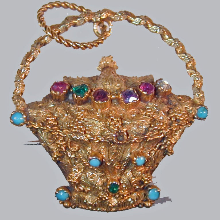 Antique 18K gold cannetille basket brooch set across the top with a ruby, emerald, garnet, amethyst, ruby and diamond. The first letters of the stones spell 