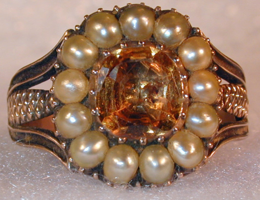 Georgian topaz ring surrounded by natural pearls in a striking setting of 15K gold. The reverse is engraved with the initials 