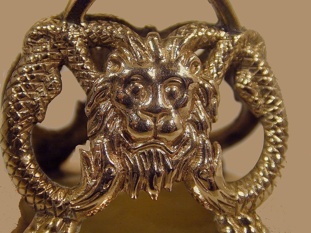 Impressively large fob seal of a lions head and claws encircled by snakes. The seal is quartz engraved with a shield shaped coat of arms decorated with nine five pointed stars and a crescent topped with a boars head crest.