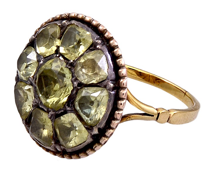 Bold pave set chrysoberyl ring in 18K gold in a closed back foiled setting. The stones came from Portuguese mines in Brazil. Fabulous jewelry was made from the various gemstones exported from these mines until the French invasion of Portugal in