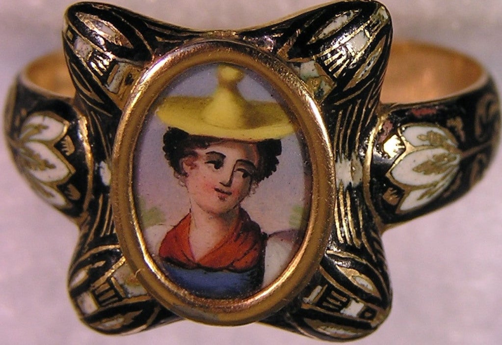 Charming and intricately enameled ring with a portrait of a country maiden. Her brightly colored costume, enhanced by a black and white frame and floral motif band, creates a stunning image to wear day or evening.  The ring is size 10 1/2.