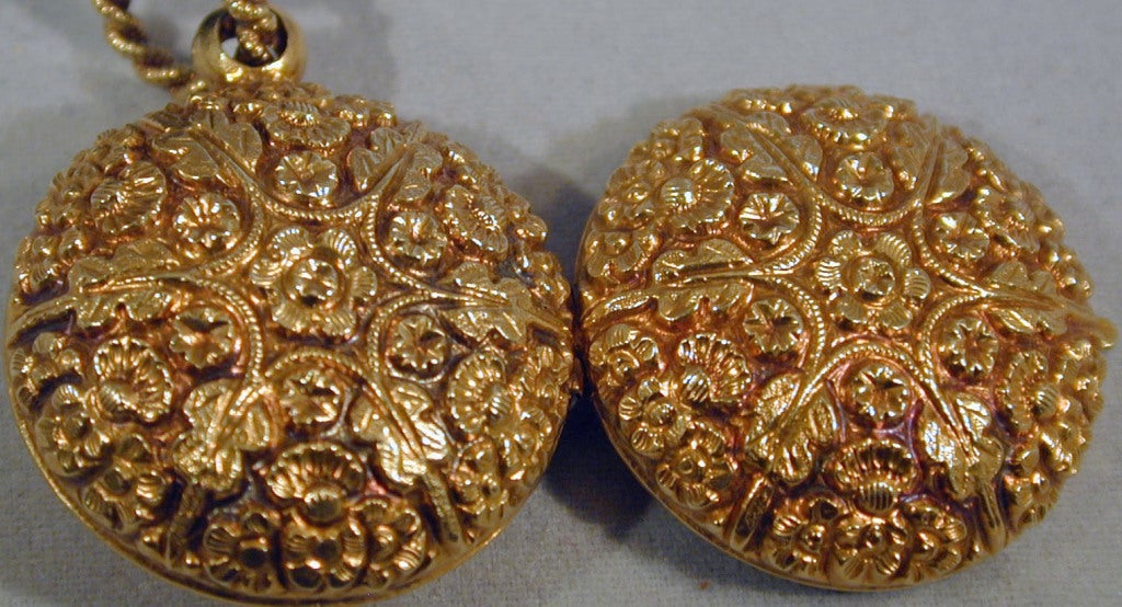 Delightful 18K gold chased locket with a floral and leaf design. Wonderful for a photo or a lock of hair as a keepsake.