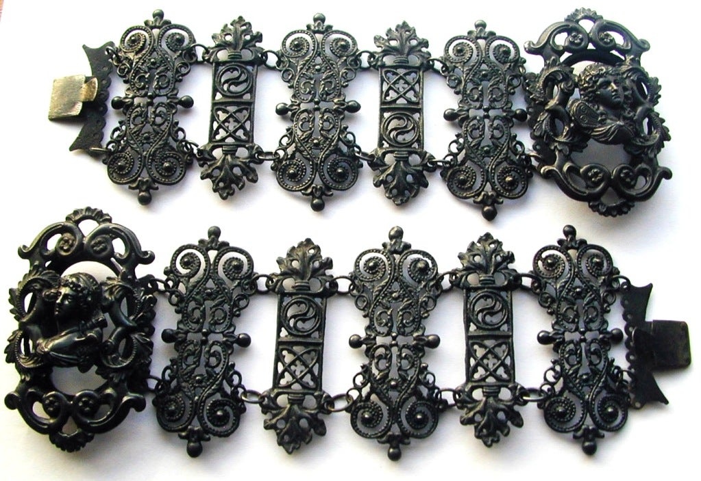 Rare Berlin Iron bracelets beautifully fashioned with ornate ironwork and classic cameos of Psyche and Venus. During the Napoleonic wars German citizens donated their precious jewelry to the war effort and in return wore iron jewelry. It continued