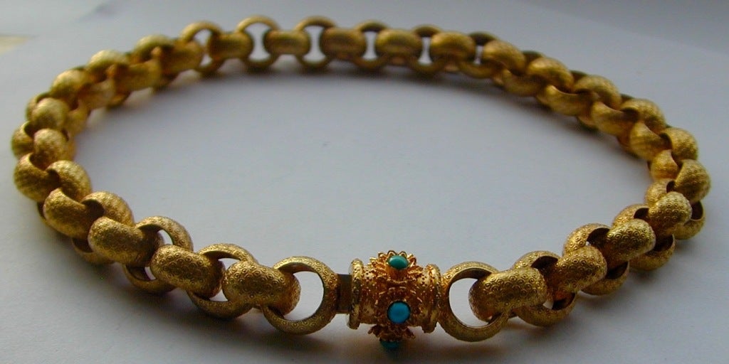 Antique Pinchbeck necklace with a barrel clasp set with turquoise stones.  Pinchbeck, an alloy of copper and zinc, was invented in the early 18th century by Christopher Pinchbeck. It has the appearance of gold and does not tarnish. These qualities